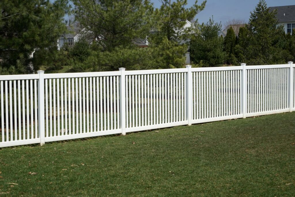 White vinyl fence in a yard