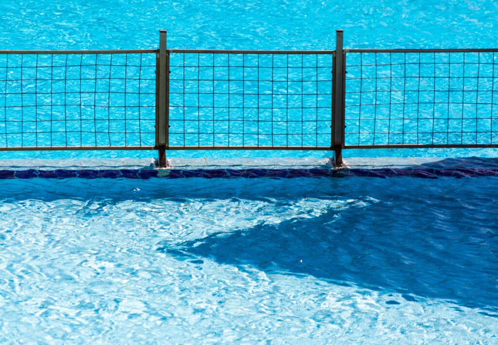 aluminum pool fence metal fence grill in the pool with blue water