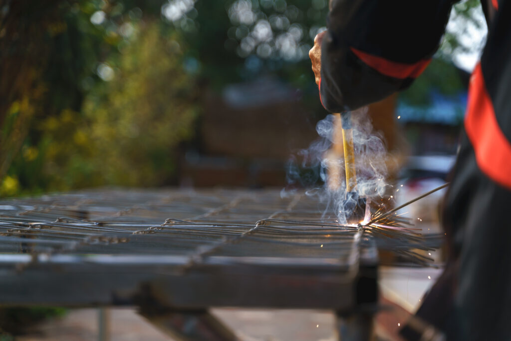 aluminum fence contractors Worker labor welding steel metal for building and reinforcement house fence door