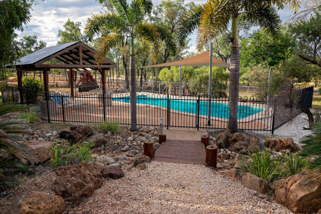 pool code aluminum fence Swimming pool and relaxation area in a country rock garden