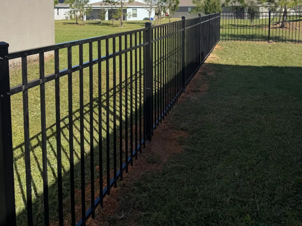 black aluminum fence on field