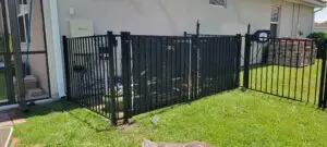 aluminum fence installation beige house