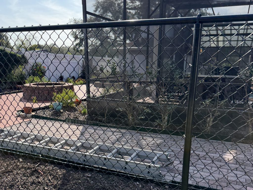 residential black chain link fence another fence on the back