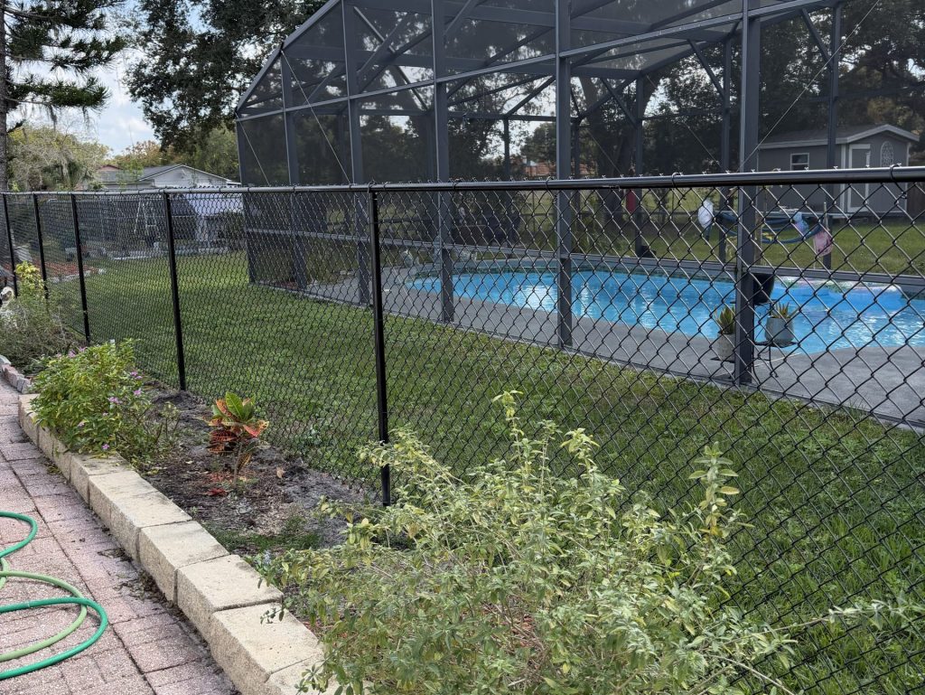 residential black chain link fence big pool on the back