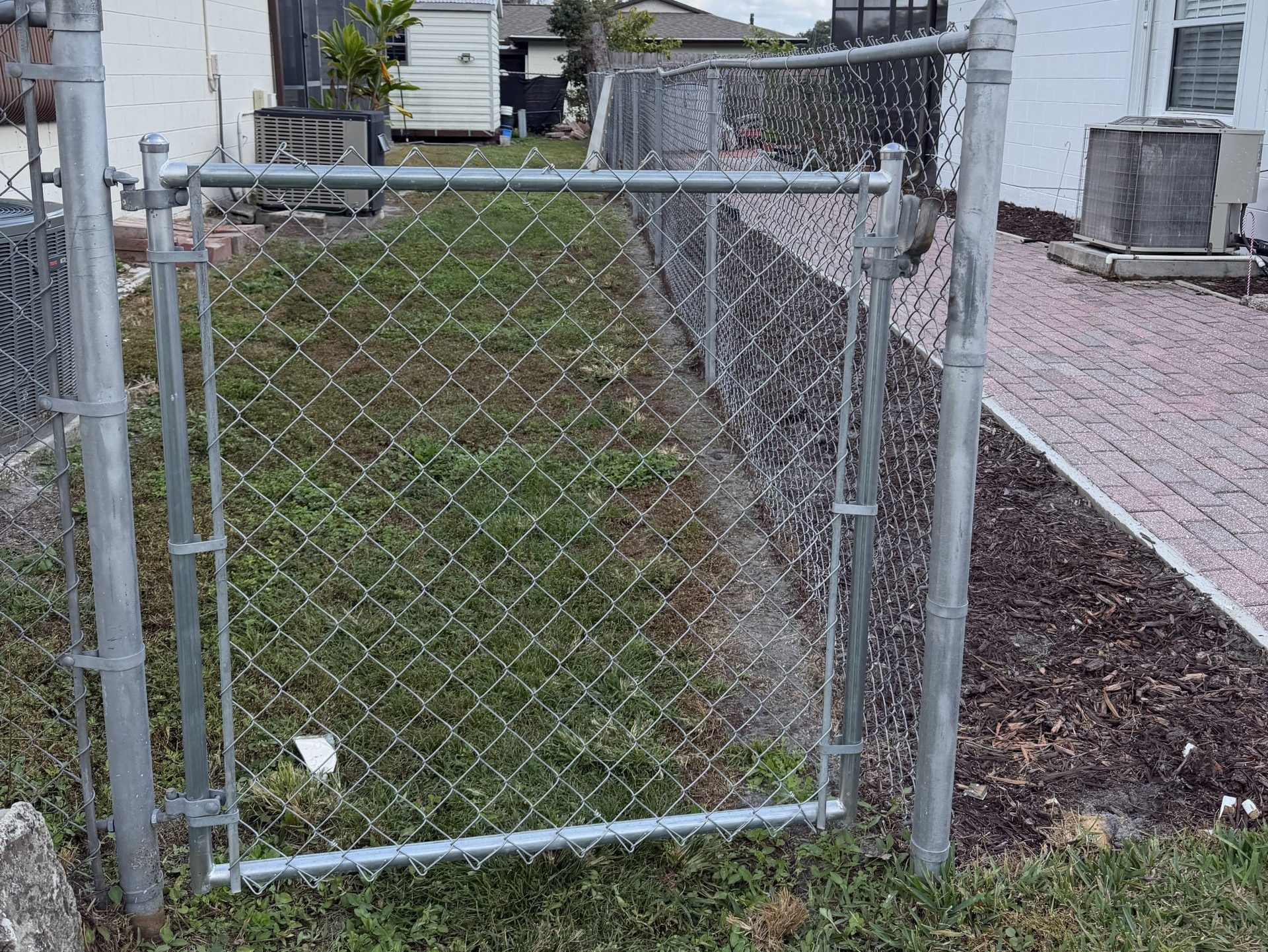 chain link fence cost grey fence white wall big house