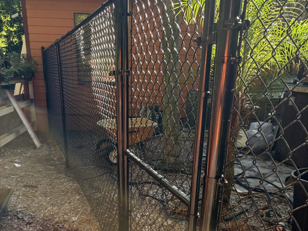 chain link fence replacement black fence close up