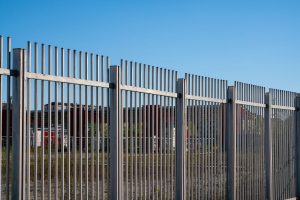 fence with steel metal grate. Detail of the grate is made with a resistant and solid structure which increases the safety of the premises