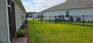 Black aluminium fence around a home’s yard