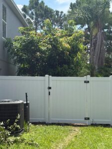 A white fence on the grass