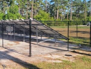 A chain-link fence near a solar panel